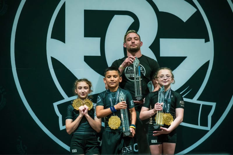 Labyrinth BJJ athletes with trophies and medals at a competition