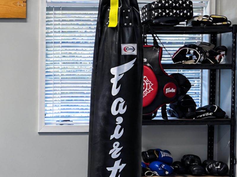 Heavy bag and striking gear on the shelves at Labyrinth BJJ Wharton